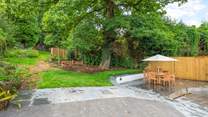 Oodles of space in the garden and terrace area. Please be aware of the steps and small stream which runs through the paved area (which is covered by a grate for safety).