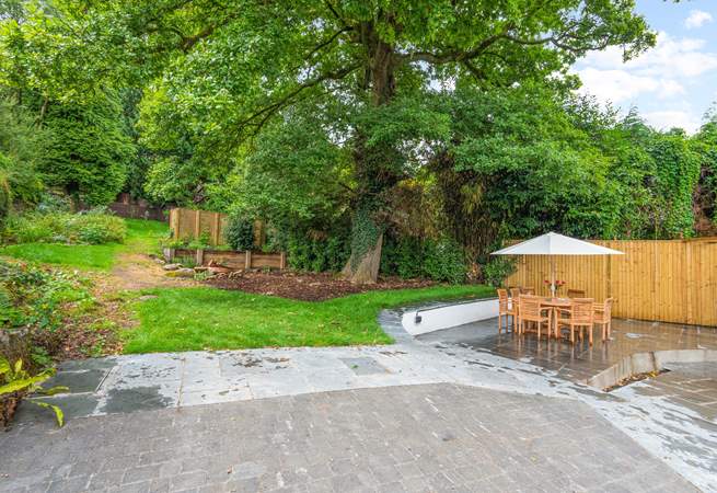 Oodles of space in the garden and terrace area. Please be aware of the steps and small stream which runs through the paved area (which is covered by a grate for safety).
