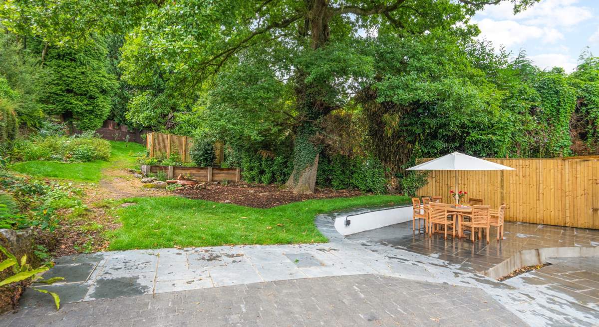 Oodles of space in the garden and terrace area. Please be aware of the steps and small stream which runs through the paved area (which is covered by a grate for safety).