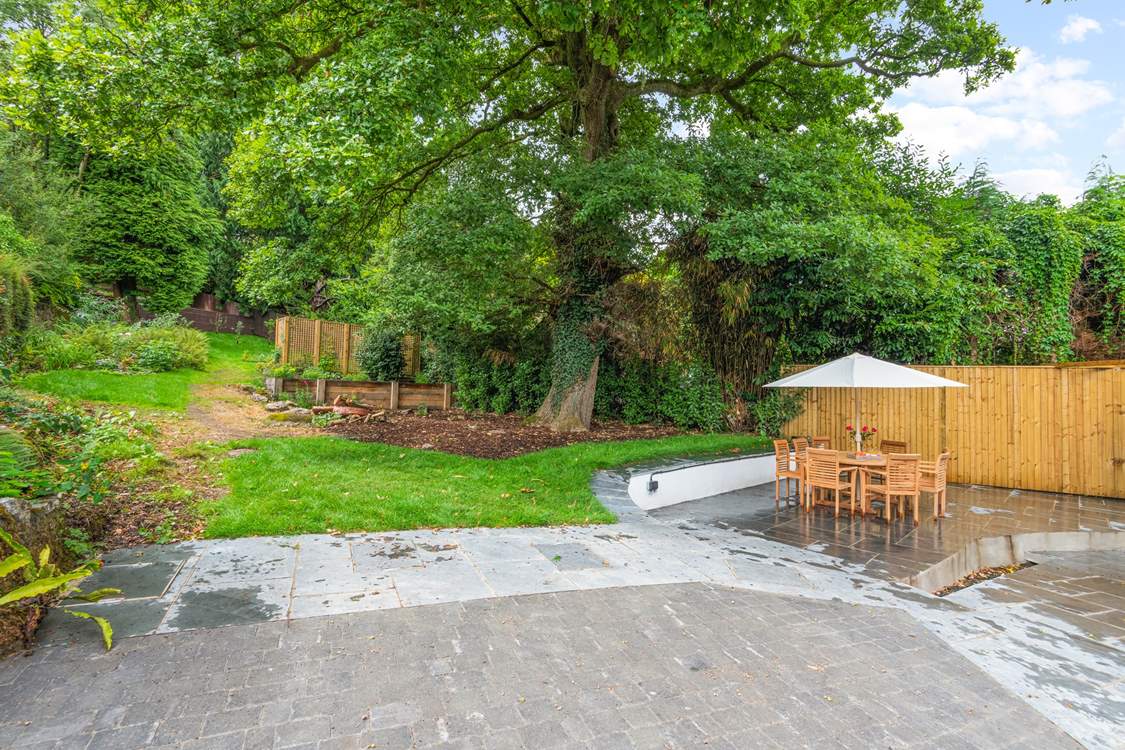Oodles of space in the garden and terrace area. Please be aware of the steps and small stream which runs through the paved area (which is covered by a grate for safety).