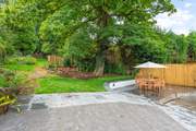 Oodles of space in the garden and terrace area. Please be aware of the steps and small stream which runs through the paved area (which is covered by a grate for safety).
