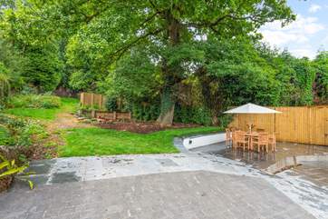 Oodles of space in the garden and terrace area. Please be aware of the steps and small stream which runs through the paved area (which is covered by a grate for safety).