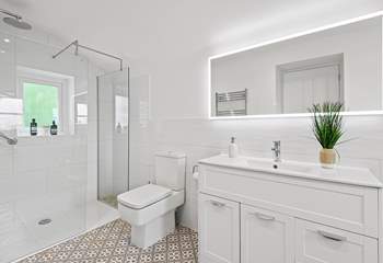 The en suite has a spacious shower.