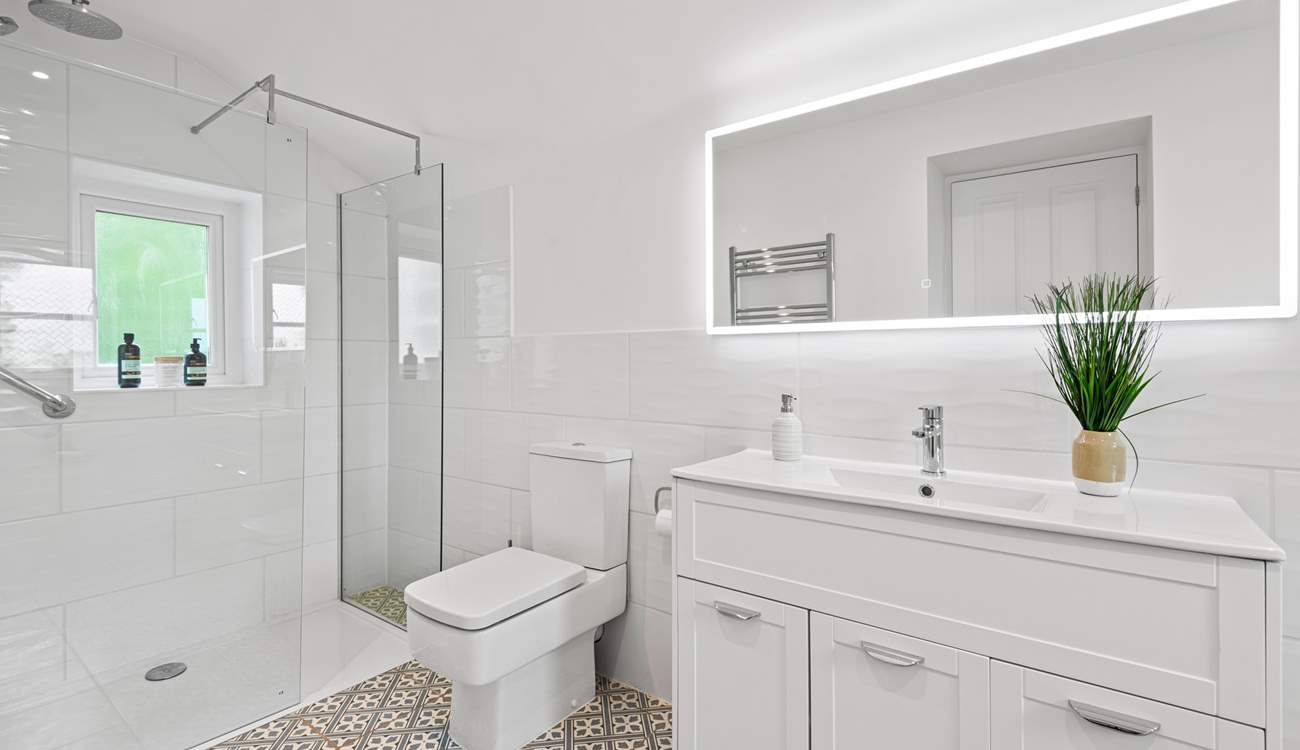 The en suite has a spacious shower.