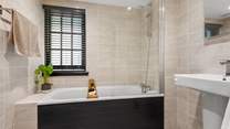 This gorgeous bathroom is the en suite to bedroom one.