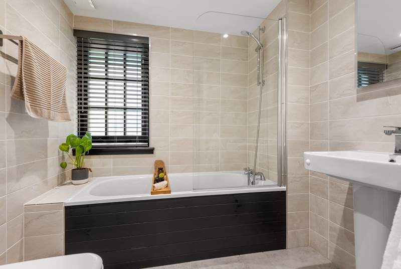 This gorgeous bathroom is the en suite to bedroom one.