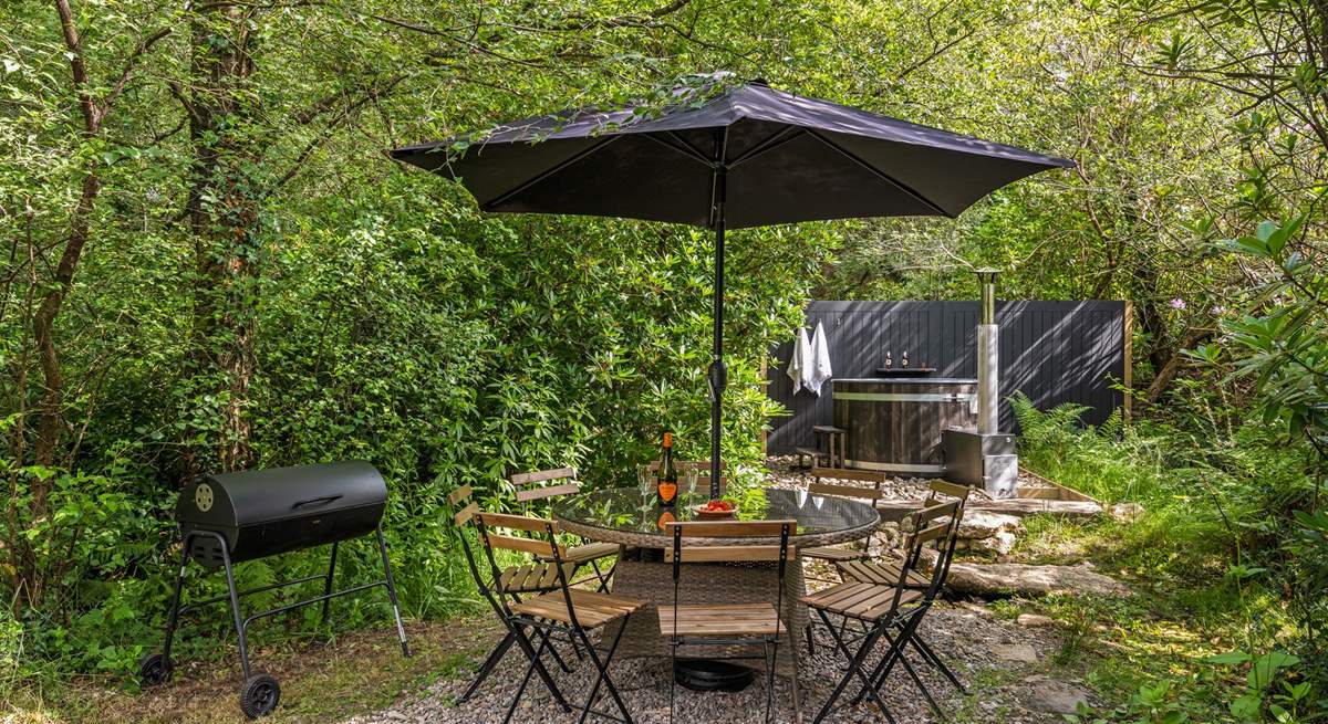 Outdoor living at its best. Please note there is a trickling steam running through the garden and if there is water flowing there are stepping stones to reach the hot tub. 