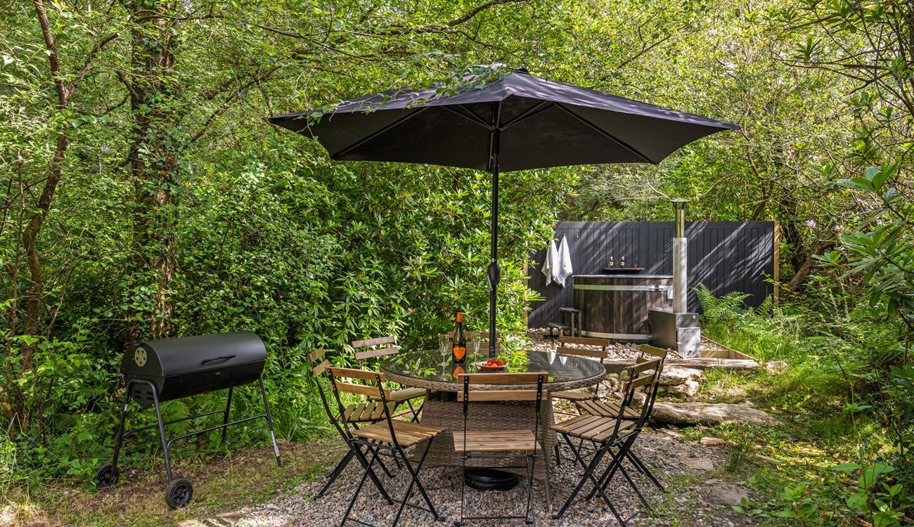 Outdoor living at its best. Please note there is a trickling steam running through the garden and if there is water flowing there are stepping stones to reach the hot tub. 