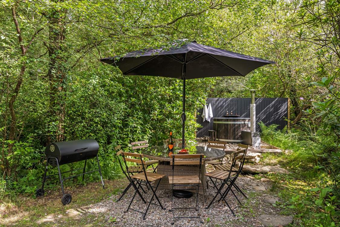 Outdoor living at its best. Please note there is a trickling steam running through the garden and if there is water flowing there are stepping stones to reach the hot tub.
