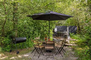 Outdoor living at its best. Please note there is a trickling steam running through the garden and if there is water flowing there are stepping stones to reach the hot tub.