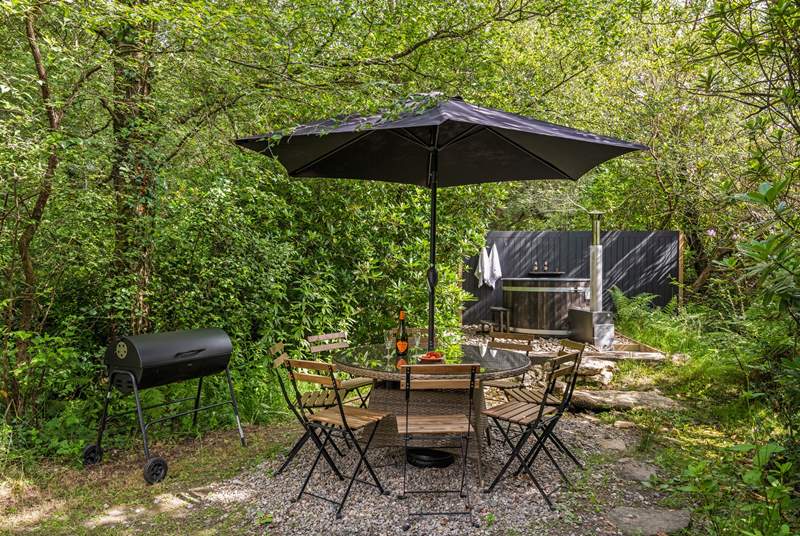 Outdoor living at its best. Please note there is a trickling steam running through the garden and if there is water flowing there are stepping stones to reach the hot tub. 
