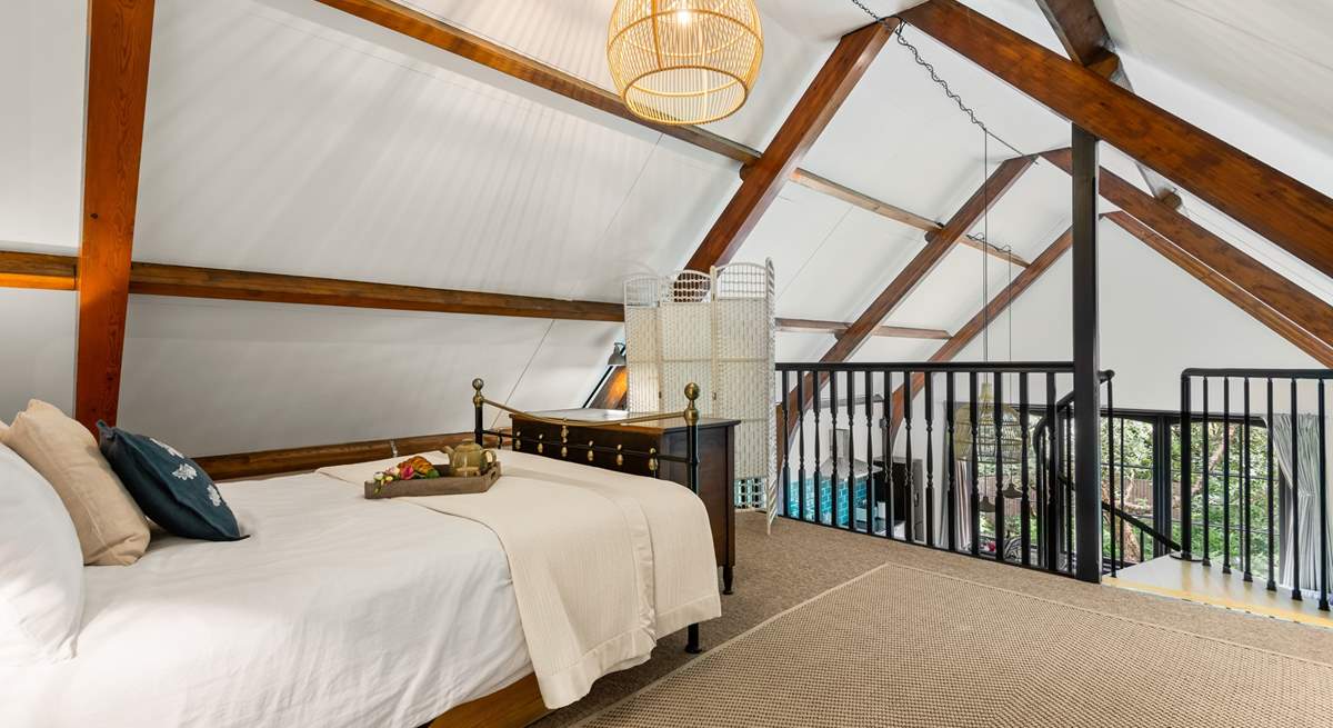 This beautiful bedroom has a feature wrought-iron bedstead.  