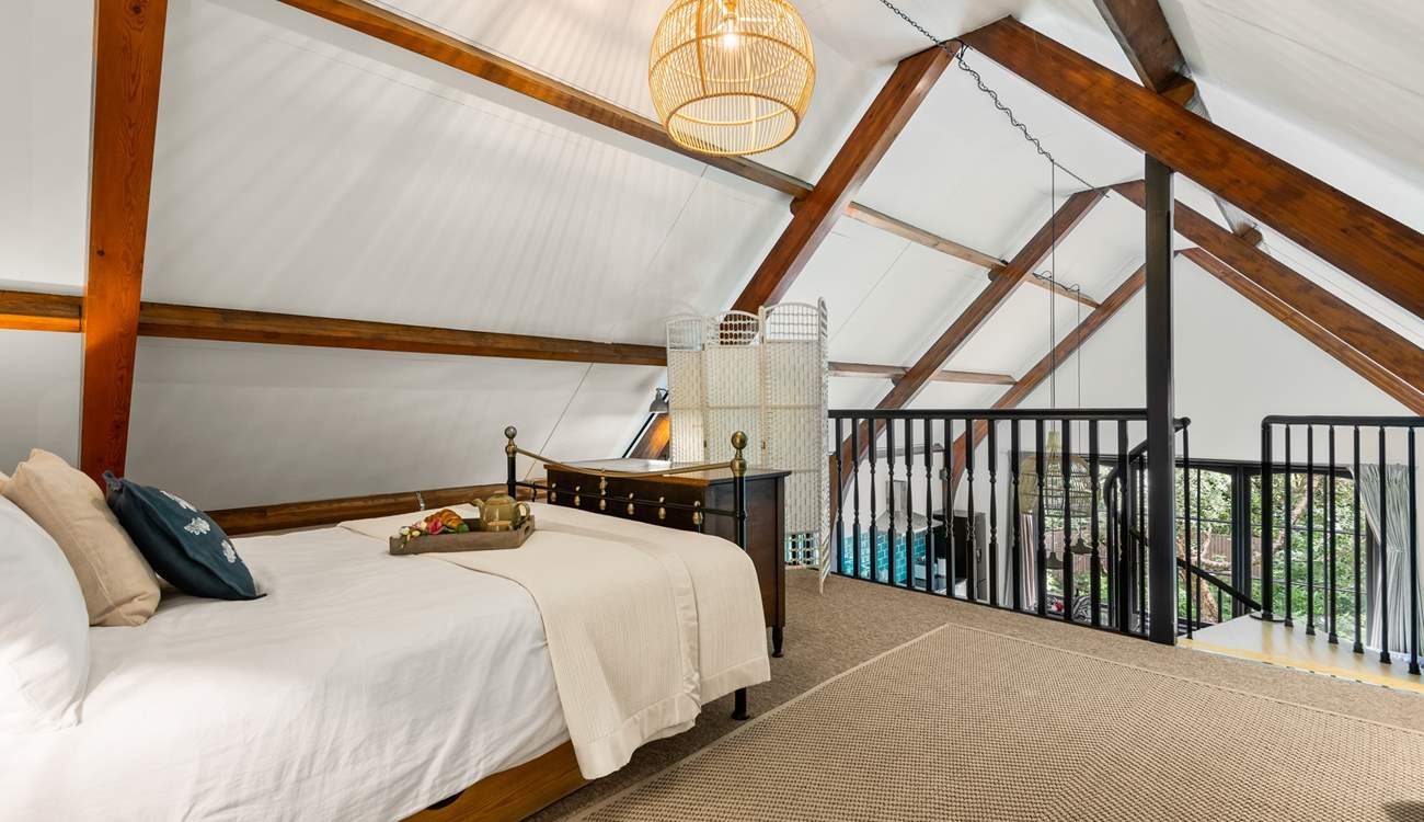 This beautiful bedroom has a feature wrought-iron bedstead.  