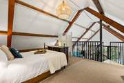 This beautiful bedroom has a feature wrought-iron bedstead.