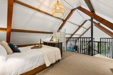 This beautiful bedroom has a feature wrought-iron bedstead.