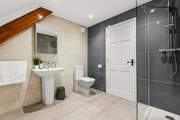 The super en suite has a fabulous walk-in shower.