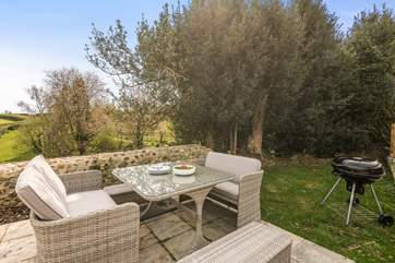 Enjoy the sunshine in The Barn's outside seating area.