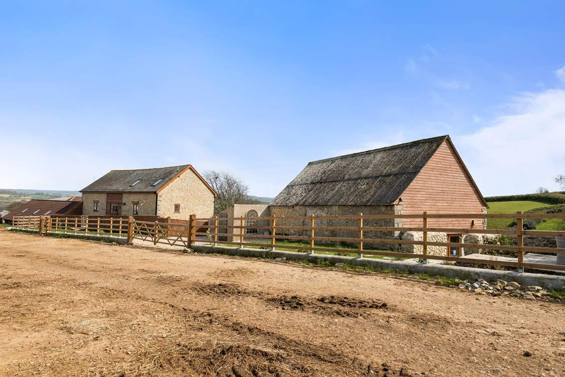 The Barn is on the left, the games-room to the right, and sitting area for The Barn is next to the games-room on the right.
