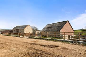 The Barn is on the left, the games-room to the right, and sitting area for The Barn is next to the games-room on the right.