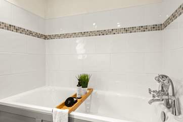 Enjoy a soak in the bath tub.