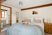 Bedroom 1 has a sumptuous king-size bed.