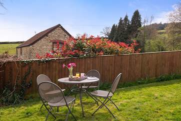 The shared outside seating-area is a lovely spot for enjoying the sunshine.