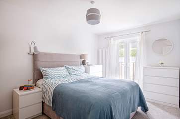 Settle down in bedroom one's lavish king-size bed.