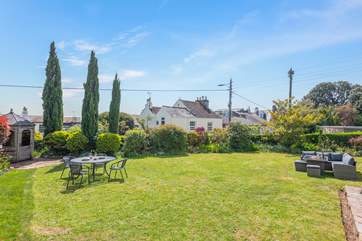 Take in the glorious Devonshire sunshine in the large garden area.