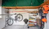 The outside shed is perfect for storing wetsuits, paddle boards, and bicycles. - Thumbnail Image