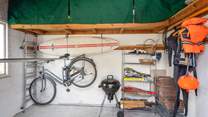 The outside shed is perfect for storing wetsuits, paddle boards, and bicycles.