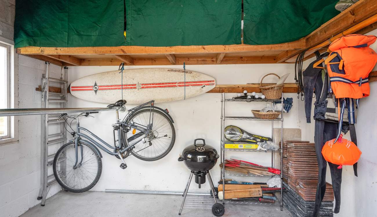 The outside shed is perfect for storing wetsuits, paddle boards, and bicycles.