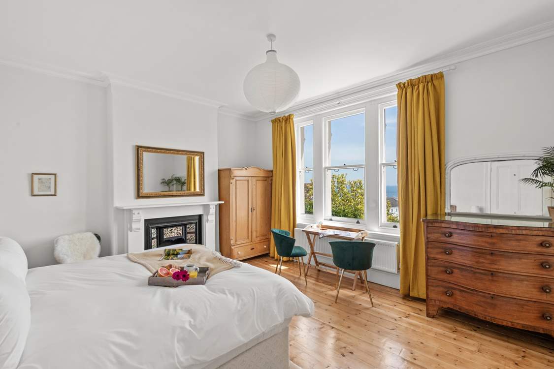 Wake to the crisp morning sun peeking through the curtains in bedroom five.