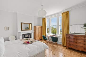 Wake to the crisp morning sun peeking through the curtains in bedroom five.