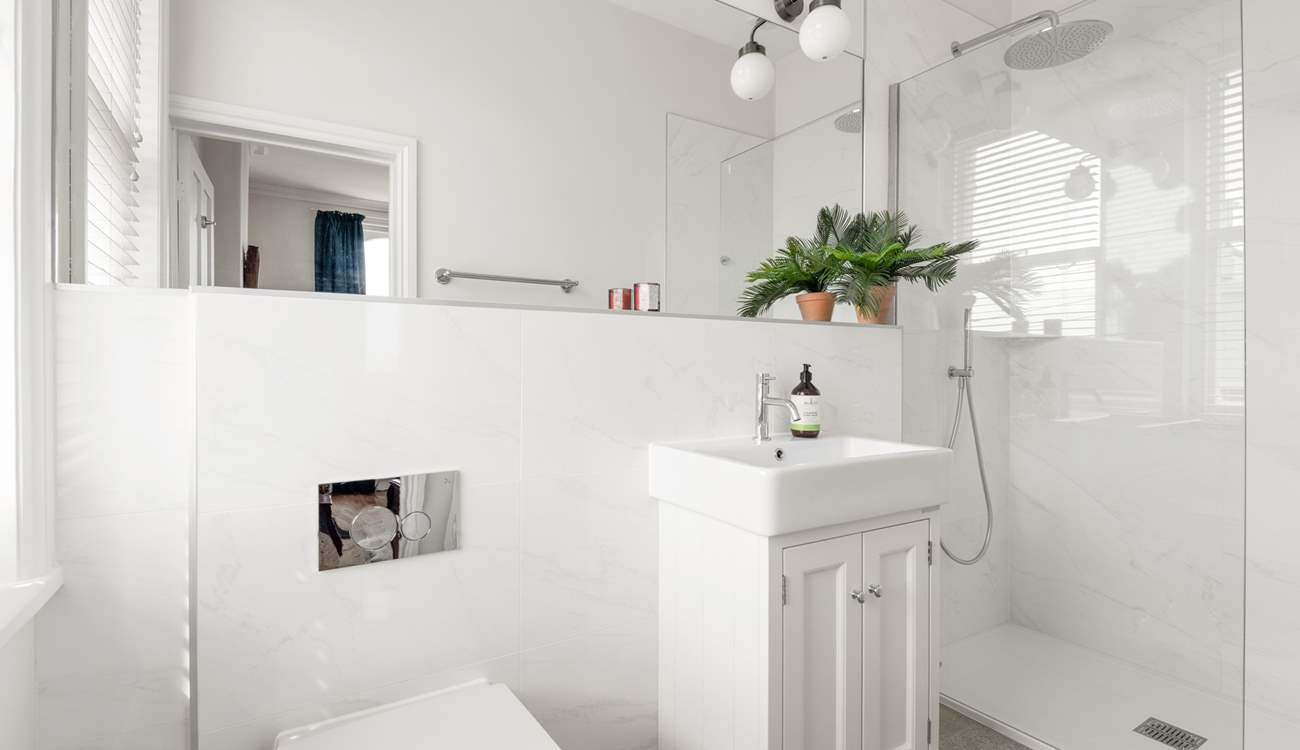 Bedroom four also comes equipped with a crisp en suite.