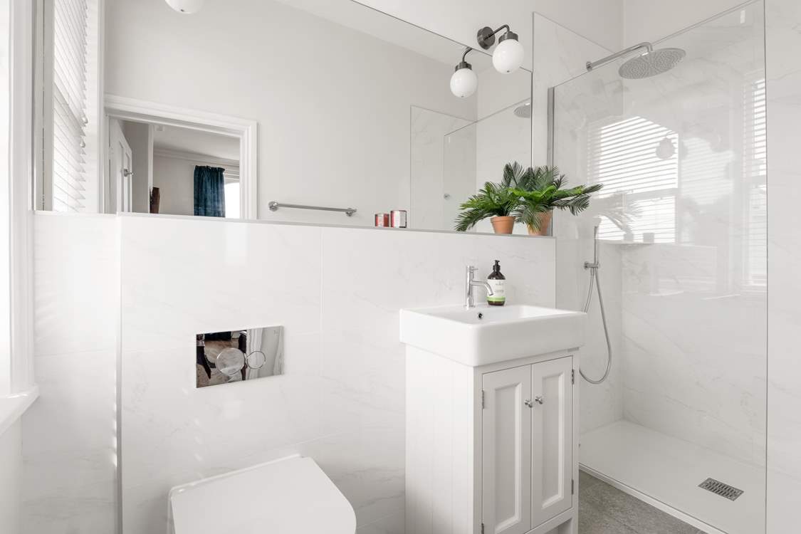 Bedroom four also comes equipped with a crisp en suite.