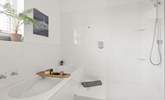 Unwind after a long day in the inviting bath and shower. - Thumbnail Image