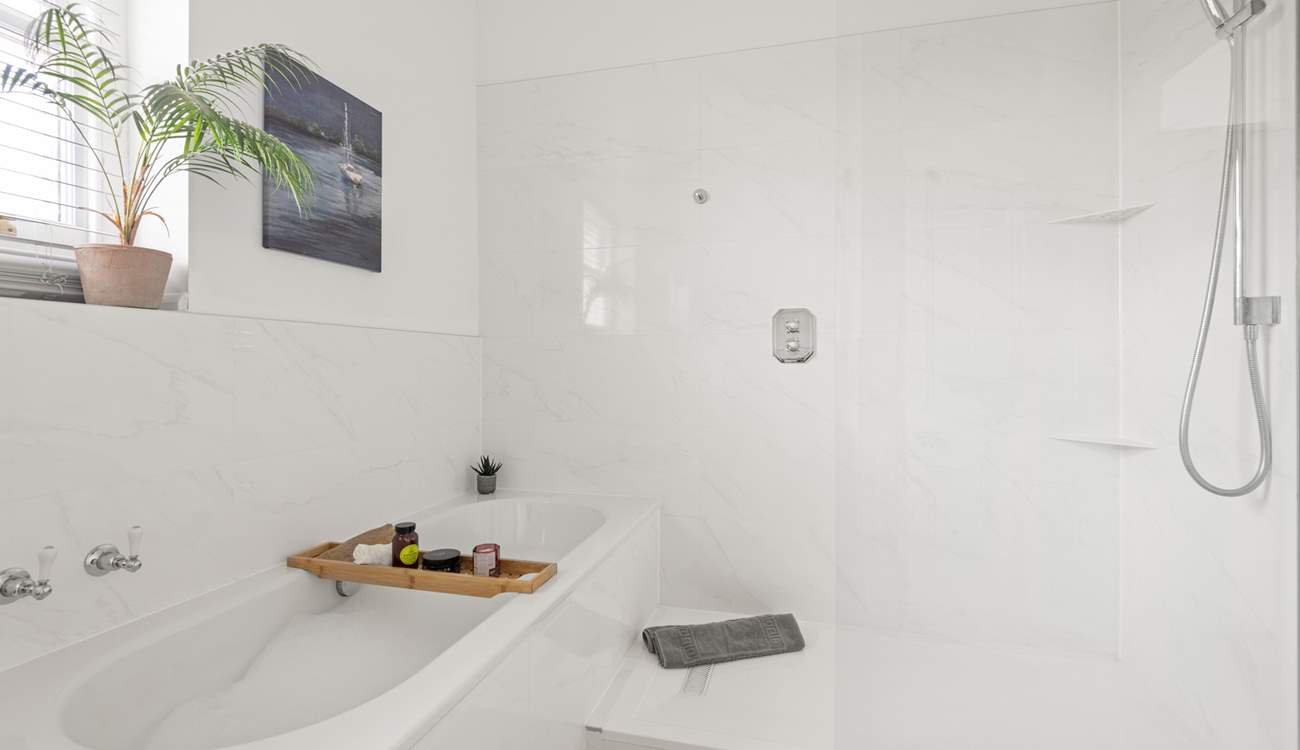 Unwind after a long day in the inviting bath and shower.