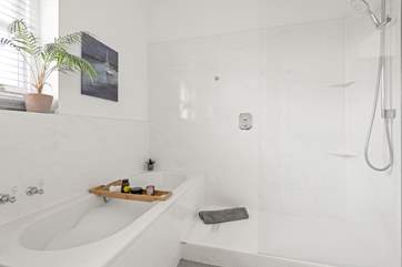 Unwind after a long day in the inviting bath and shower.