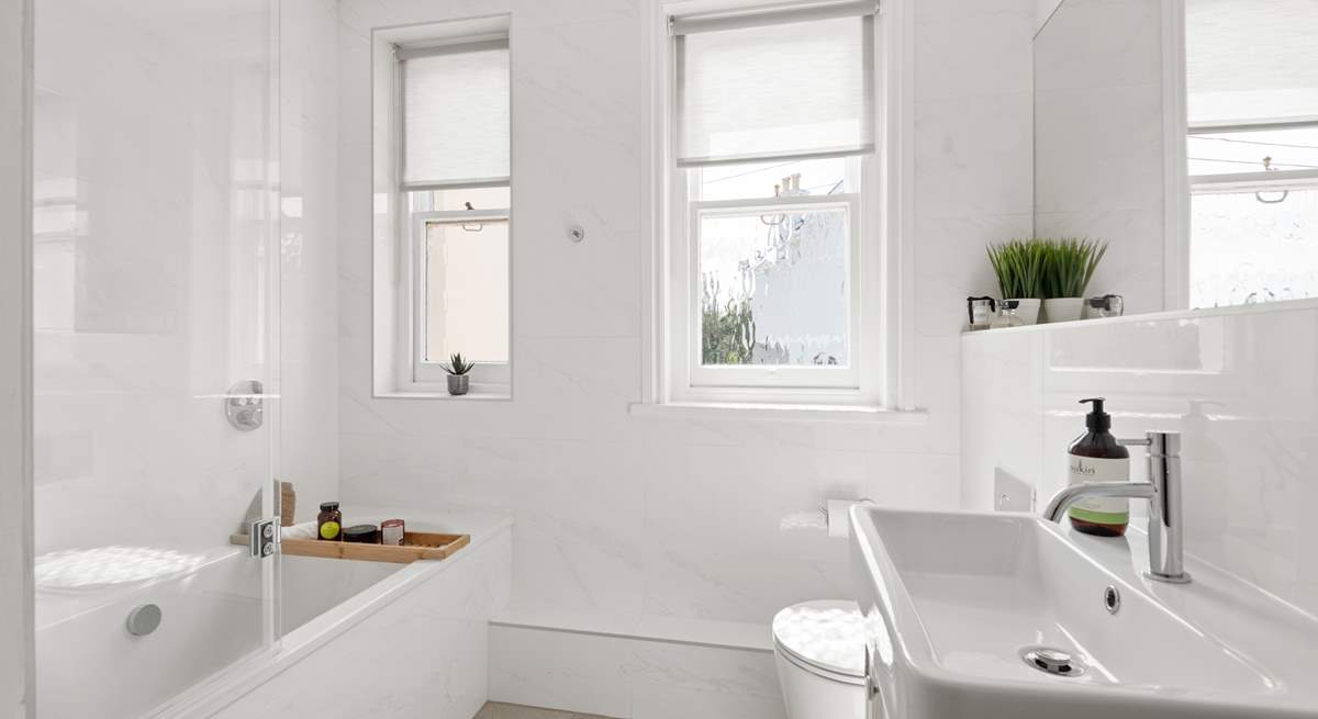 A beautifully finished bathroom joins bedroom one on the half-landing.