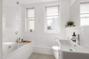 A beautifully finished bathroom joins bedroom one on the half-landing.
