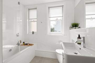 A beautifully finished bathroom joins bedroom one on the half-landing.