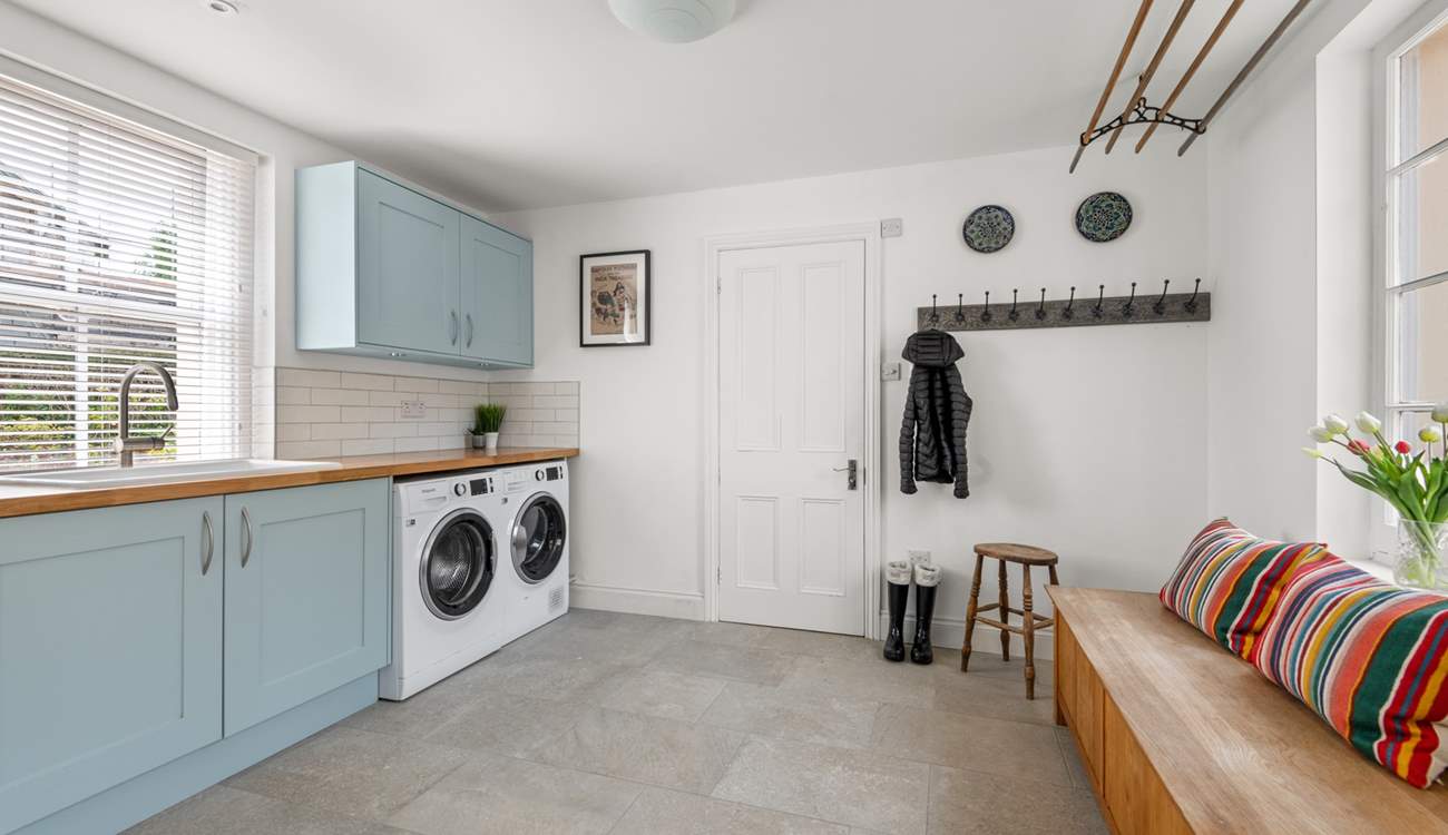 The handy utility-room is great for storing muddy boots.