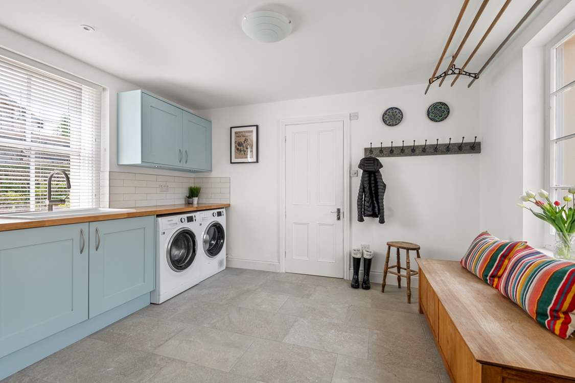 The handy utility-room is great for storing muddy boots.