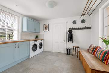 The handy utility-room is great for storing muddy boots.