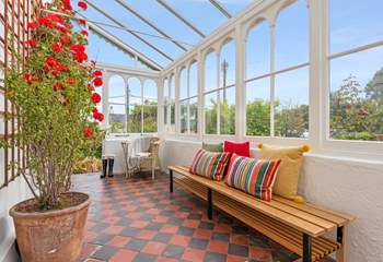 Enter through the marvellous conservatory. 