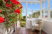Wander through the conservatory into the beautiful garden.