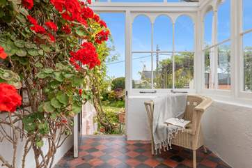 Wander through the conservatory into the beautiful garden.
