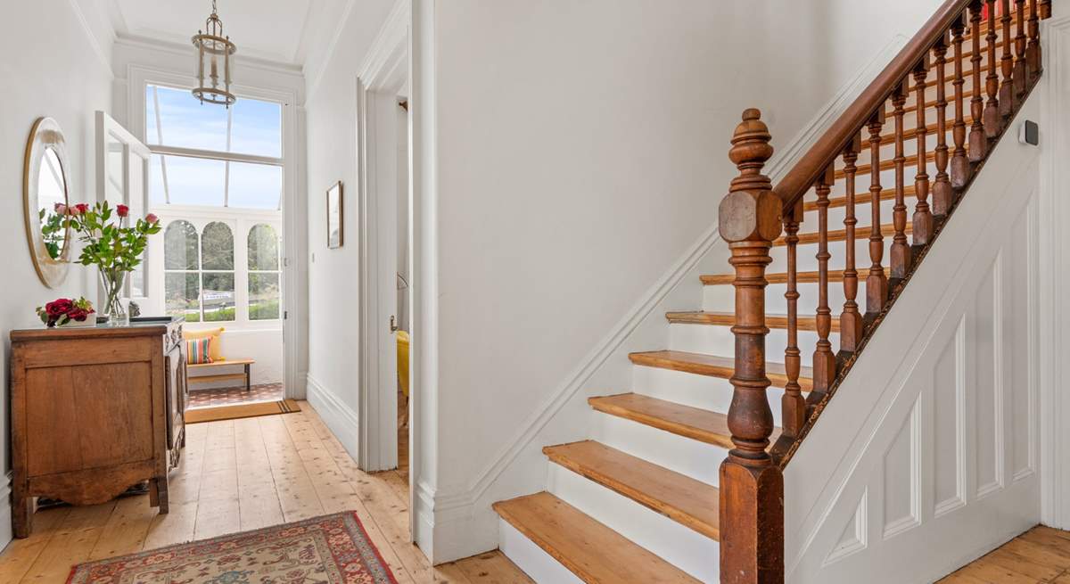 Venture up the beautiful wooden staircase to discover the other bedrooms.