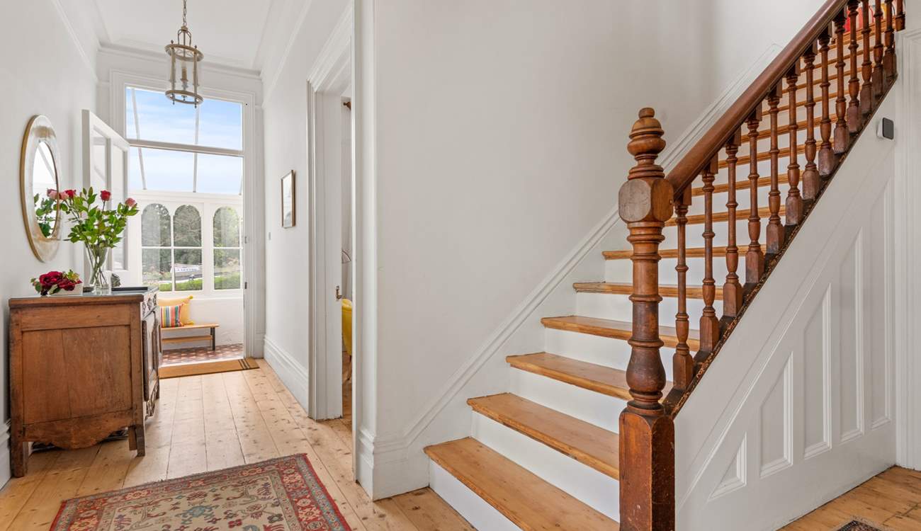 Venture up the beautiful wooden staircase to discover the other bedrooms.