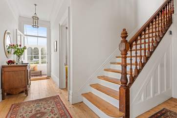 Venture up the beautiful wooden staircase to discover the other bedrooms.